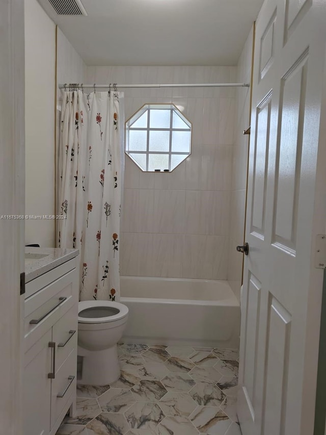 full bathroom featuring toilet, shower / tub combo with curtain, and vanity