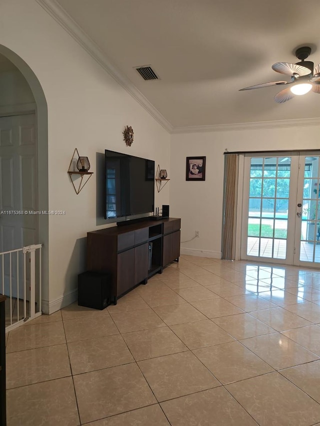 tiled living room featuring ornamental molding, vaulted ceiling, and ceiling fan