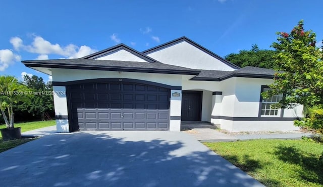 view of front of property with a garage