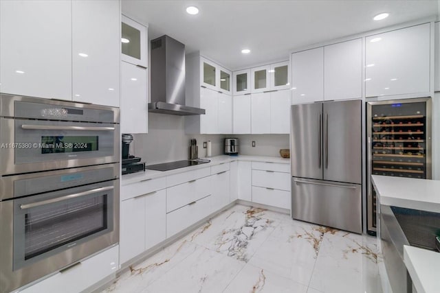 kitchen with stainless steel appliances, wall chimney range hood, wine cooler, and white cabinetry