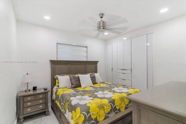 bedroom featuring ceiling fan and a closet