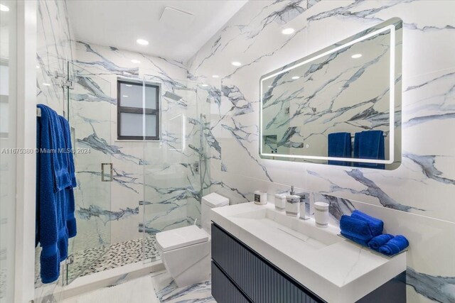 bathroom featuring toilet, an enclosed shower, tile walls, backsplash, and vanity