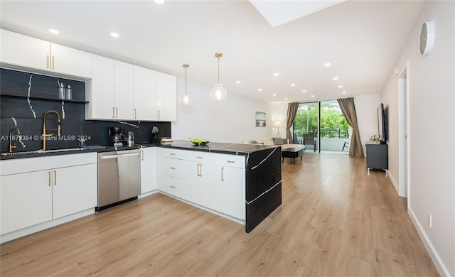 600 Three Islands Blvd Unit 214, Hallandale Beach, FL 33009 - kitchen with stainless steel dishwasher, dark countertops, a peninsula, white cabinets, and recessed lighting