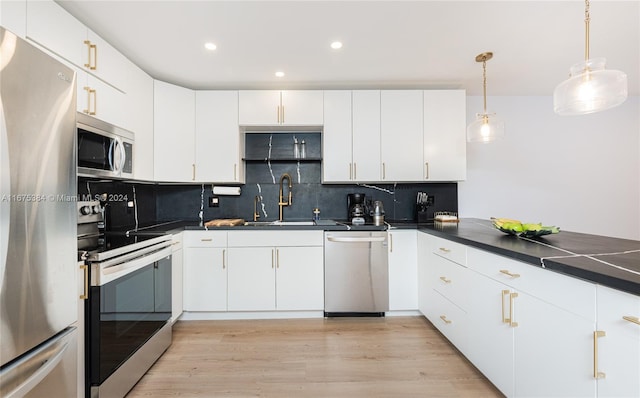 600 Three Islands Blvd Unit 214, Hallandale Beach, FL 33009 - kitchen with appliances with stainless steel finishes, a sink, dark countertops, recessed lighting, and backsplash