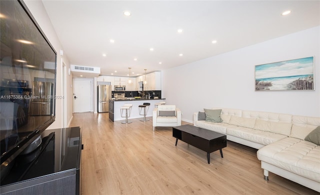 600 Three Islands Blvd Unit 214, Hallandale Beach, FL 33009 - living room featuring light wood-type flooring and recessed lighting