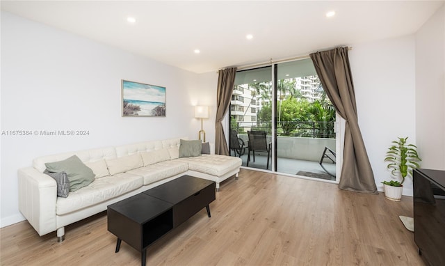600 Three Islands Blvd Unit 214, Hallandale Beach, FL 33009 - living area with expansive windows, light wood-style flooring, and recessed lighting