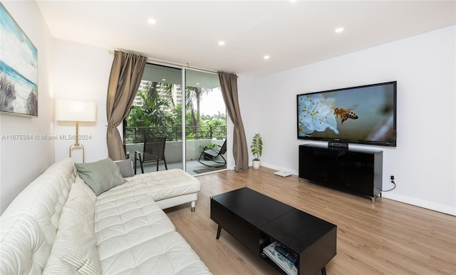 600 Three Islands Blvd Unit 214, Hallandale Beach, FL 33009 - living room featuring wood finished floors, recessed lighting, and baseboards
