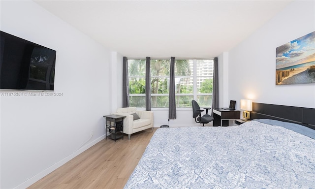 600 Three Islands Blvd Unit 214, Hallandale Beach, FL 33009 - bedroom with light wood-type flooring and baseboards