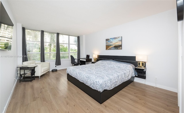 600 Three Islands Blvd Unit 214, Hallandale Beach, FL 33009 - bedroom featuring light wood finished floors and baseboards