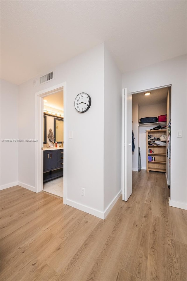 600 Three Islands Blvd Unit 214, Hallandale Beach, FL 33009 - hall with light wood-style floors and baseboards