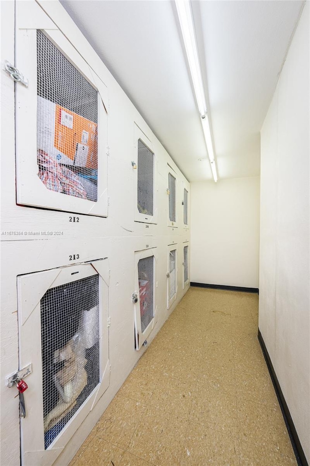 600 Three Islands Blvd Unit 214, Hallandale Beach, FL 33009 - hallway featuring tile patterned floors and baseboards