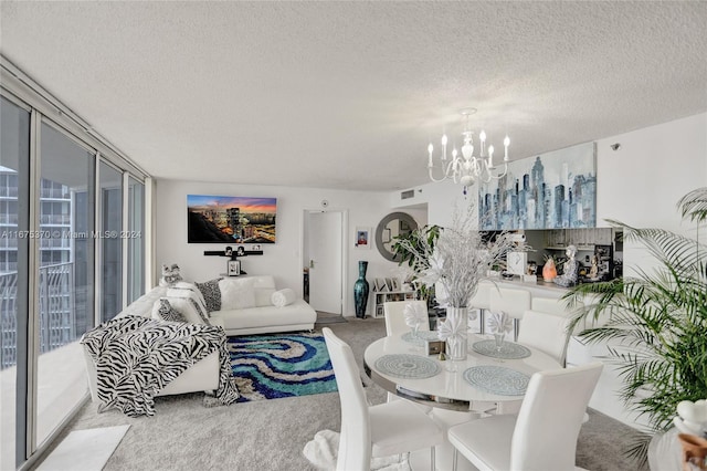 dining room featuring light carpet, a textured ceiling, and a chandelier