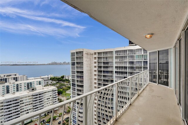 balcony featuring a water view