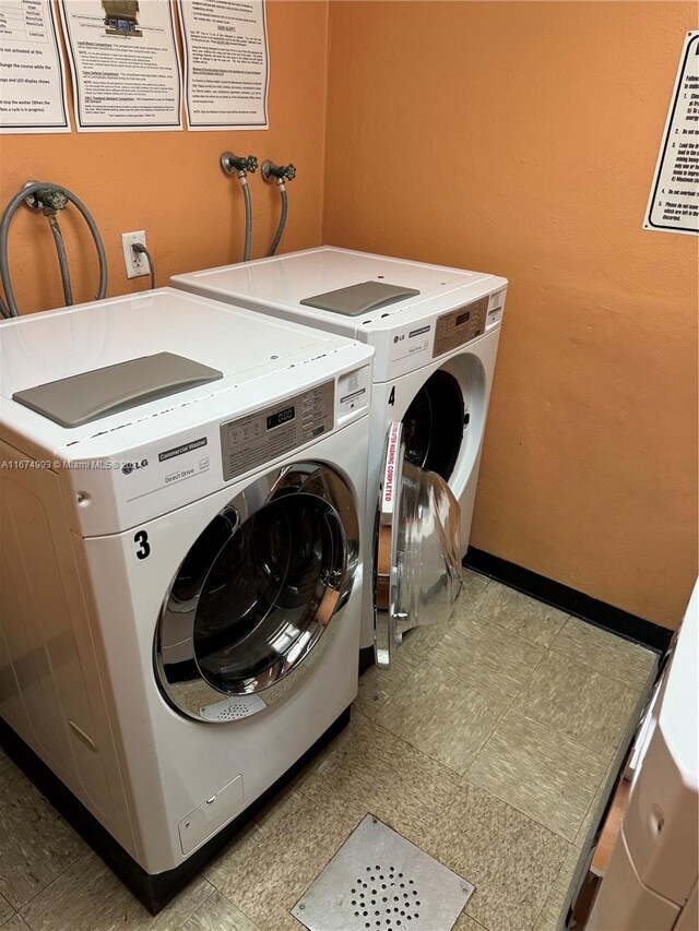 washroom with washer and dryer