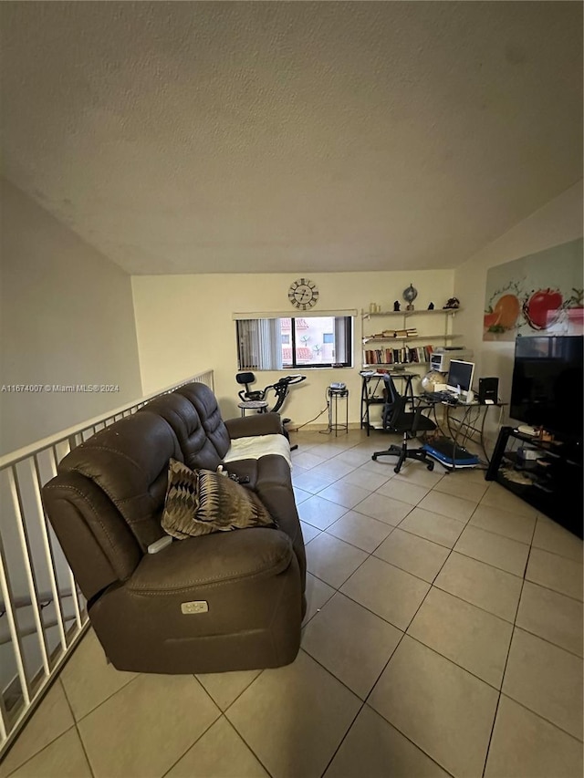 tiled living room with a textured ceiling