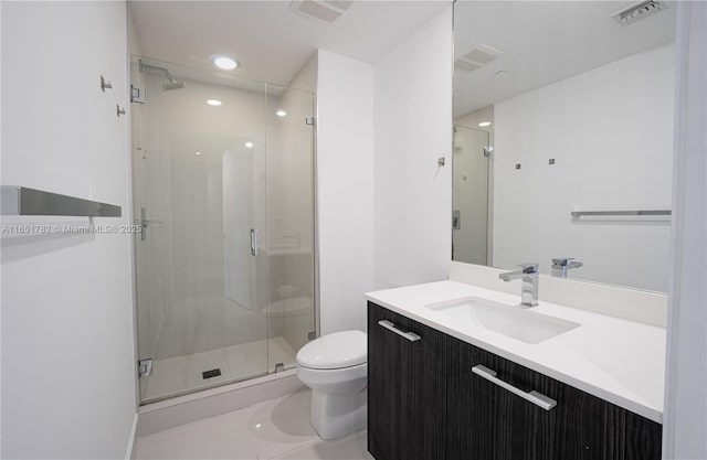 bathroom with vanity, an enclosed shower, tile patterned floors, and toilet