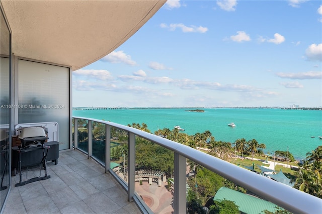 balcony featuring a water view