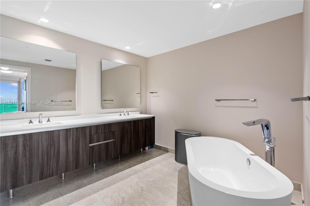 bathroom featuring vanity and a tub to relax in