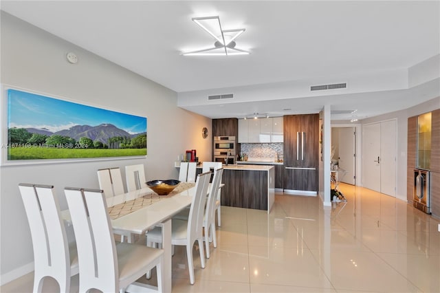 dining area with light tile patterned floors