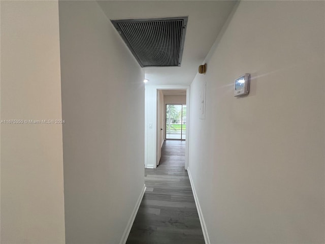 corridor with dark hardwood / wood-style floors