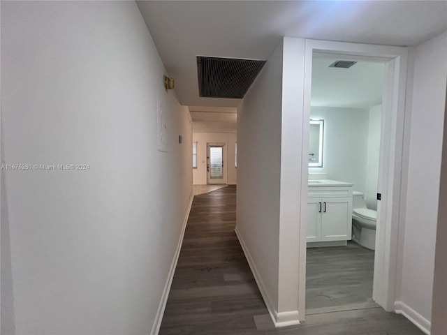 corridor featuring dark hardwood / wood-style flooring