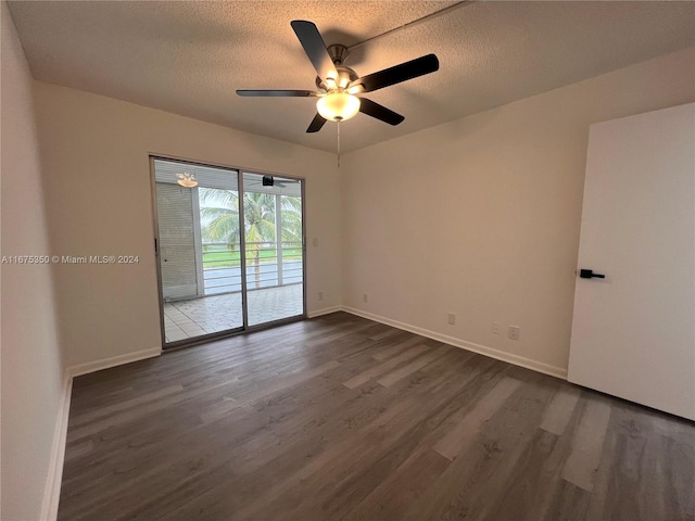 empty room featuring a textured ceiling, ceiling fan, and dark hardwood / wood-style flooring