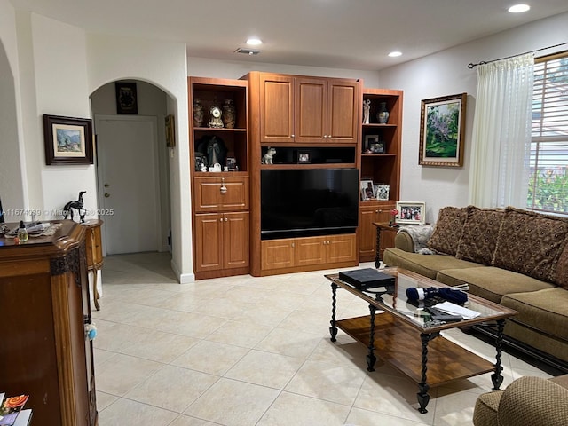 living room with light tile patterned floors