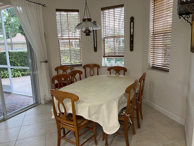 dining room featuring light tile patterned flooring