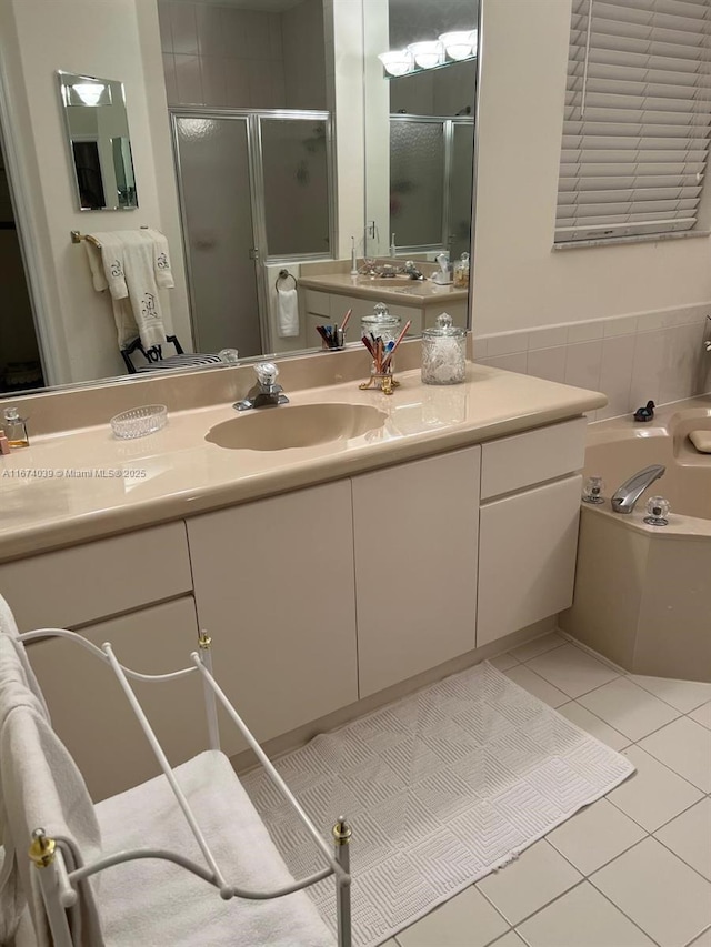 bathroom with tile patterned floors, vanity, and plus walk in shower