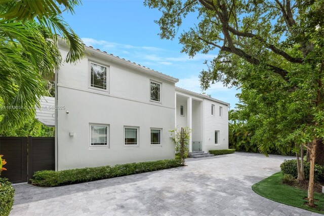 view of side of home with a patio