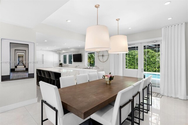 dining space featuring light tile patterned floors