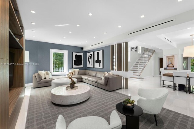 living room featuring a healthy amount of sunlight and light tile patterned flooring