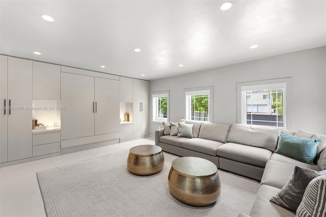 living room with light tile patterned floors and plenty of natural light