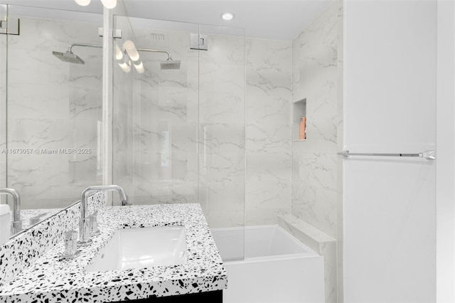 bathroom featuring vanity and combined bath / shower with glass door