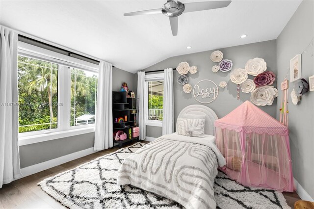 bedroom with wood-type flooring, lofted ceiling, and ceiling fan