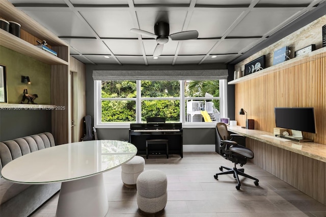 office area with ceiling fan, coffered ceiling, and built in desk