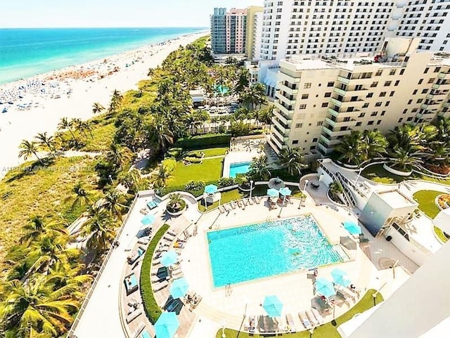 birds eye view of property with a city view, a beach view, and a water view