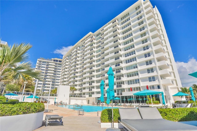 view of building exterior with a community pool