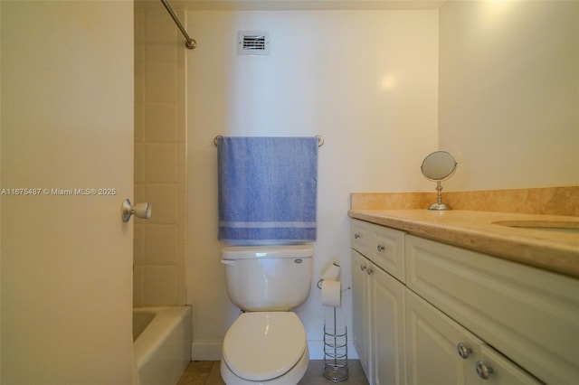 bathroom with vanity, toilet, and visible vents