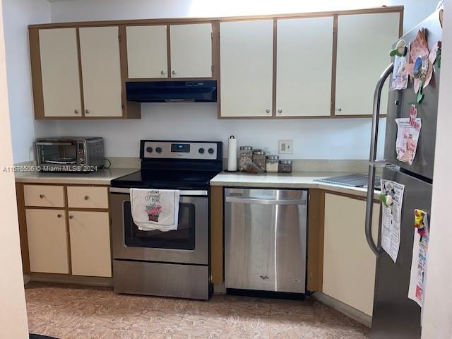 kitchen featuring extractor fan and stainless steel appliances