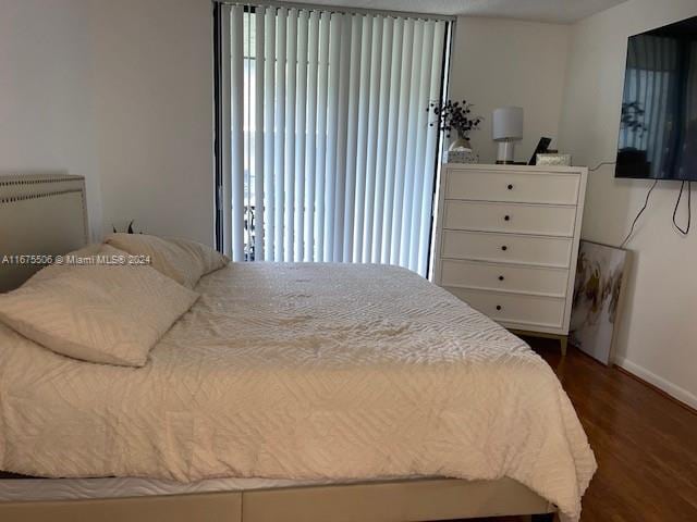 bedroom featuring dark hardwood / wood-style floors