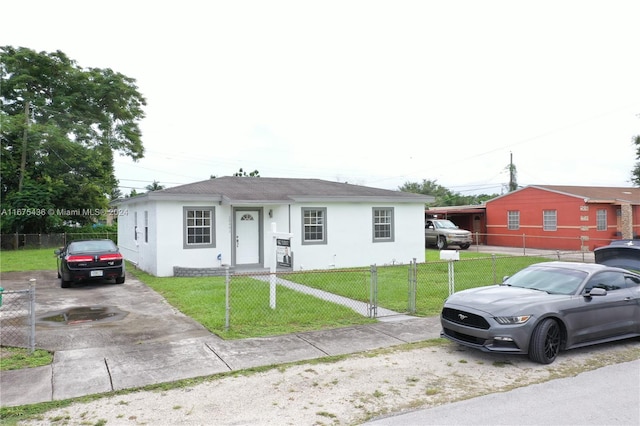 single story home with a front lawn