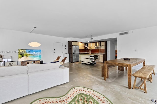 living room with concrete flooring