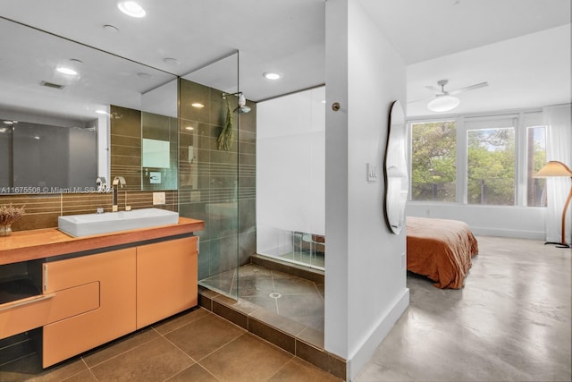 bathroom with walk in shower, vanity, concrete flooring, and ceiling fan