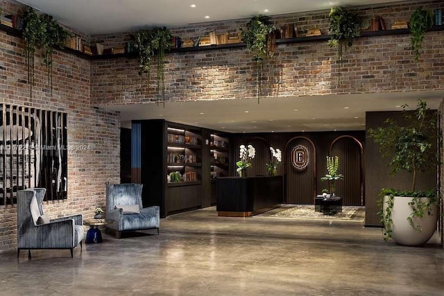 398 NE 5th St Unit 3610, Miami, FL 33132 - reception area with recessed lighting, a high ceiling, and brick wall