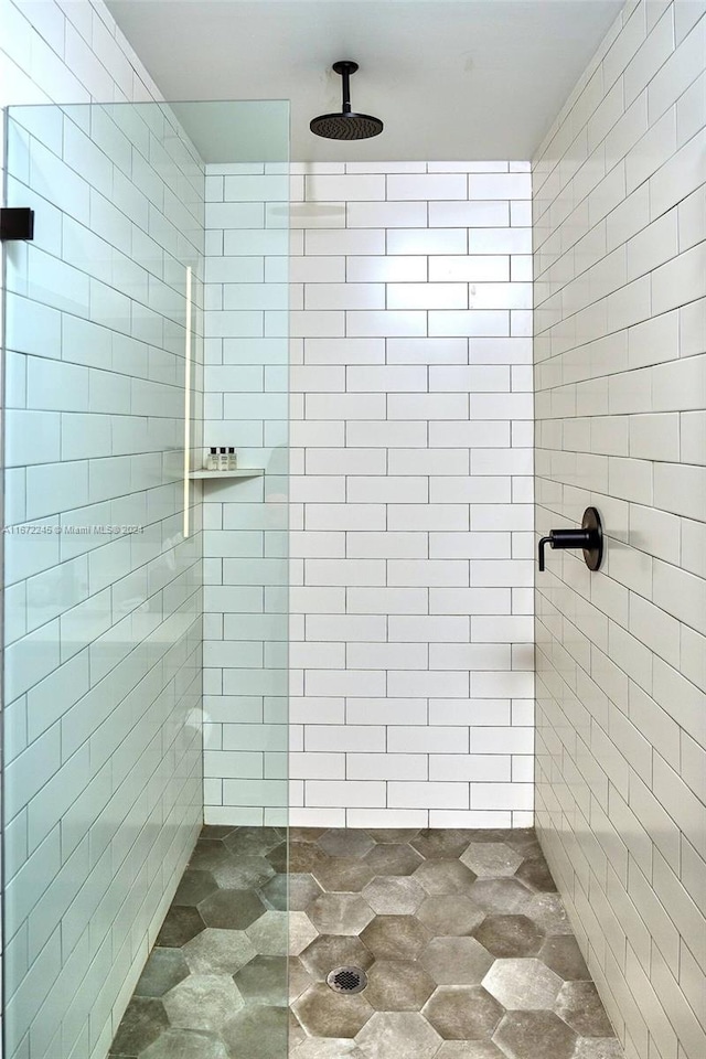 bathroom with a tile shower