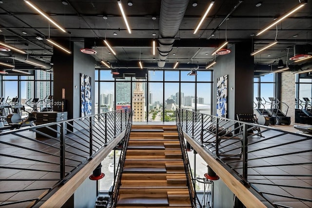 exercise room featuring expansive windows