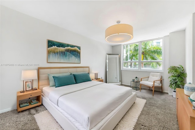 bedroom with carpet and baseboards