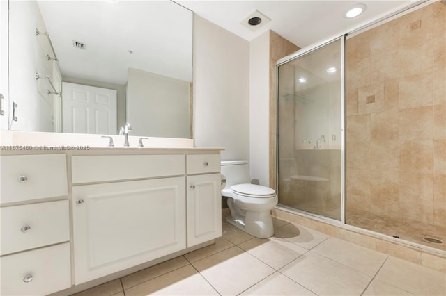 full bathroom featuring visible vents, toilet, tile patterned floors, vanity, and a shower stall