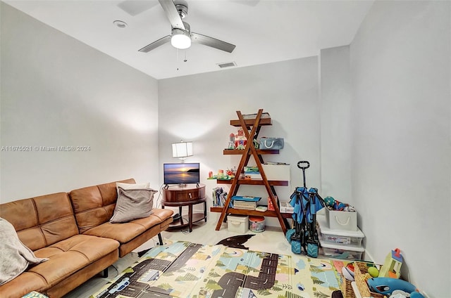 interior space with ceiling fan